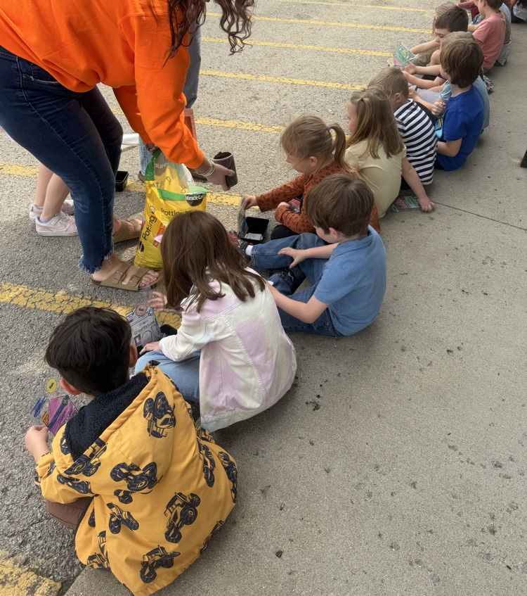 students planting grass seed 