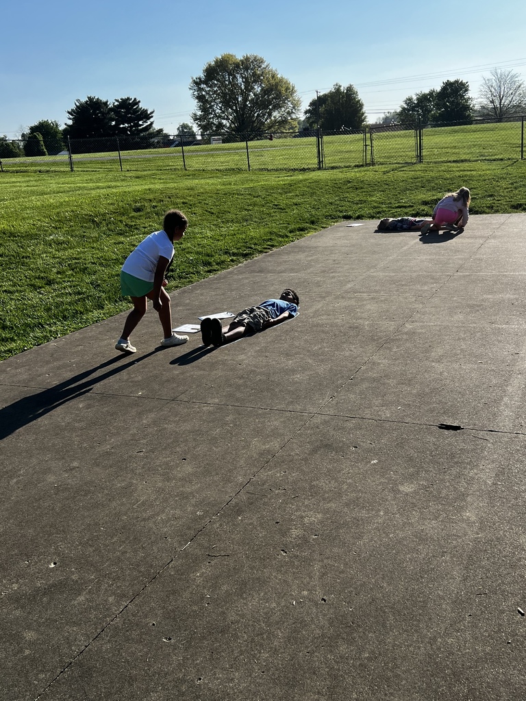 First Grade students working together to measure
