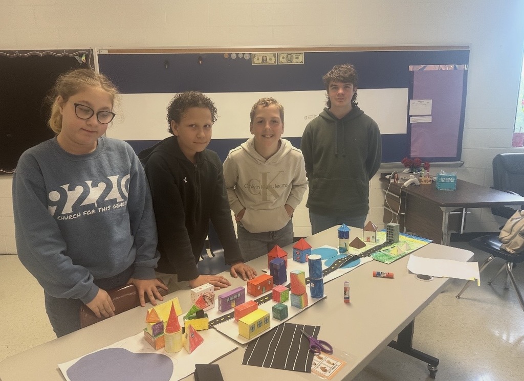 Ms. Woods' class build a city with 3D shapes after learning their characteristics. 