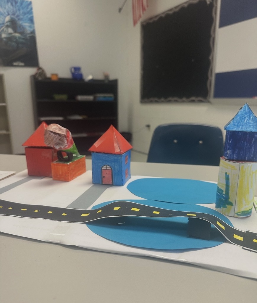 Ms. Woods' class build a city with 3D shapes after learning their characteristics. 