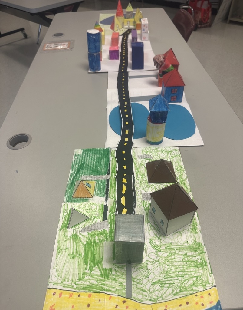 Ms. Woods' class build a city with 3D shapes after learning their characteristics. 