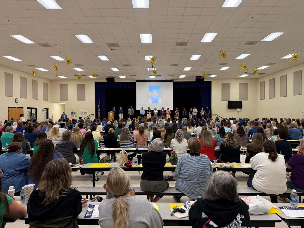 staff gathered in middle school cafeteria