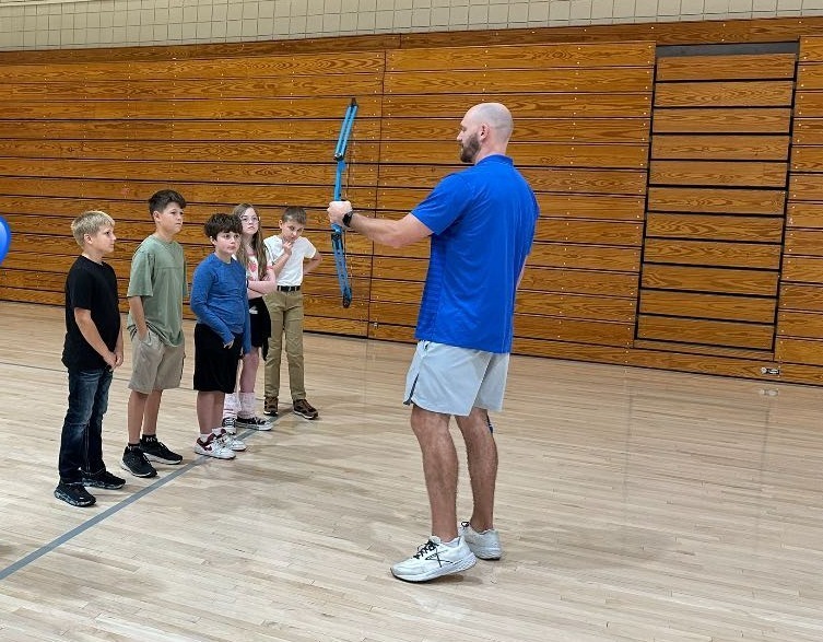 Coach Doshier talks to students