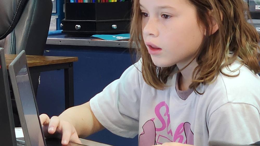 student working on computer