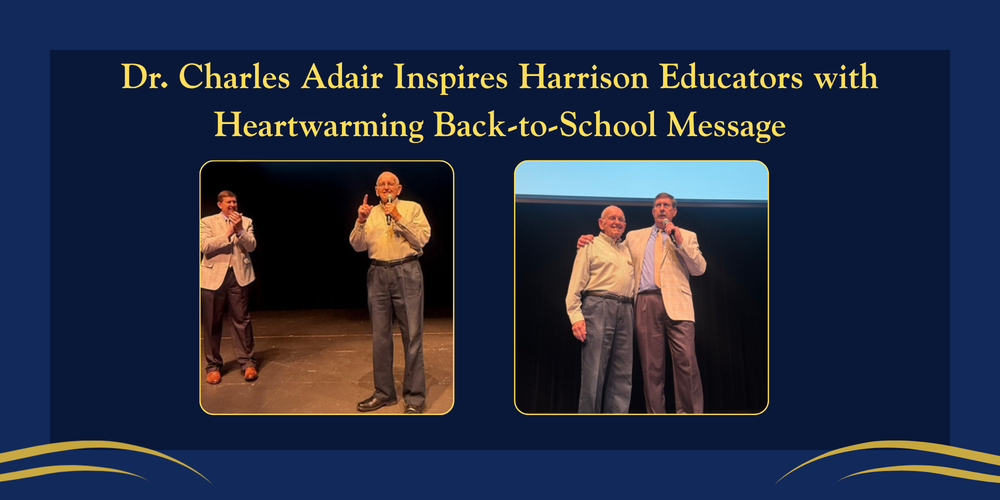 A horizontal graphic template for Harrison Public Schools featuring a dark blue background with elegant gold wave accents at the bottom. At the top, the title reads in gold text: "Dr. Charles Adair Inspires Harrison Educators with Heartwarming Back-to-School Message." Below the title are two rectangular photos framed in gold. The left photo shows Dr. Charles Adair standing on a stage speaking into a microphone with his finger raised, while another man in a light grey blazer stands behind him clapping. The right photo shows a close-up of both men smiling together on stage, with the man in the blazer holding the microphone and placing his arm around Dr. Adair's shoulder.