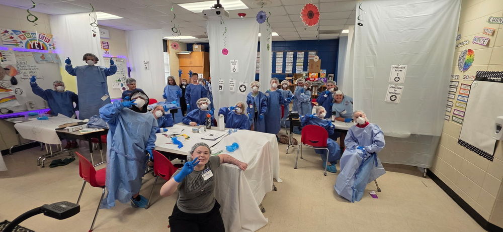 students at work wearing PPE's