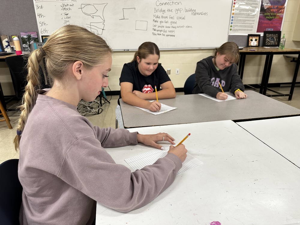 students writing letters