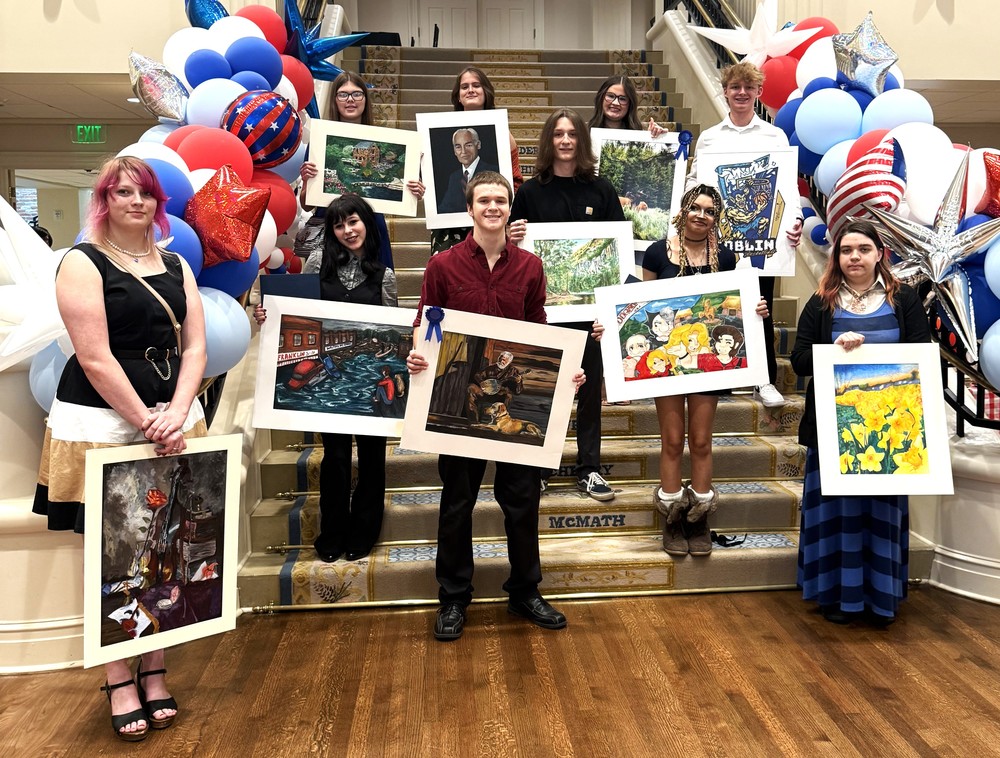 Students with their art at the Arkansas Governor's Mansion