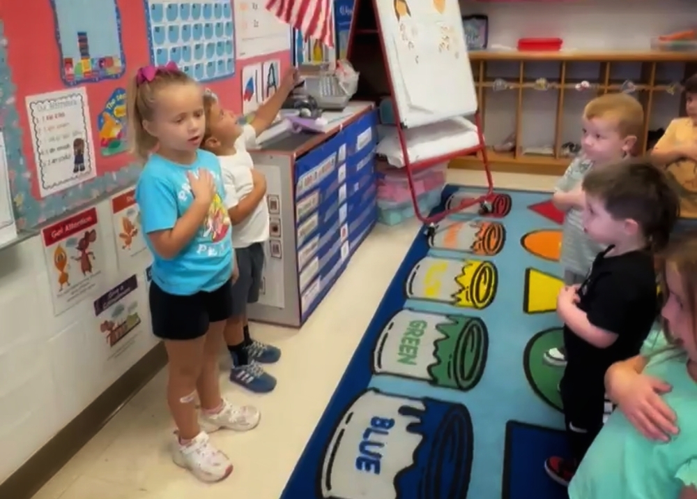 students saying the Pledge of Allegiance