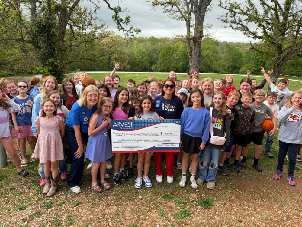 Forest Heights Students with display check from ARVEST and Spree Ragland