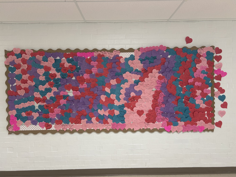 bulletin board covered in reading hearts