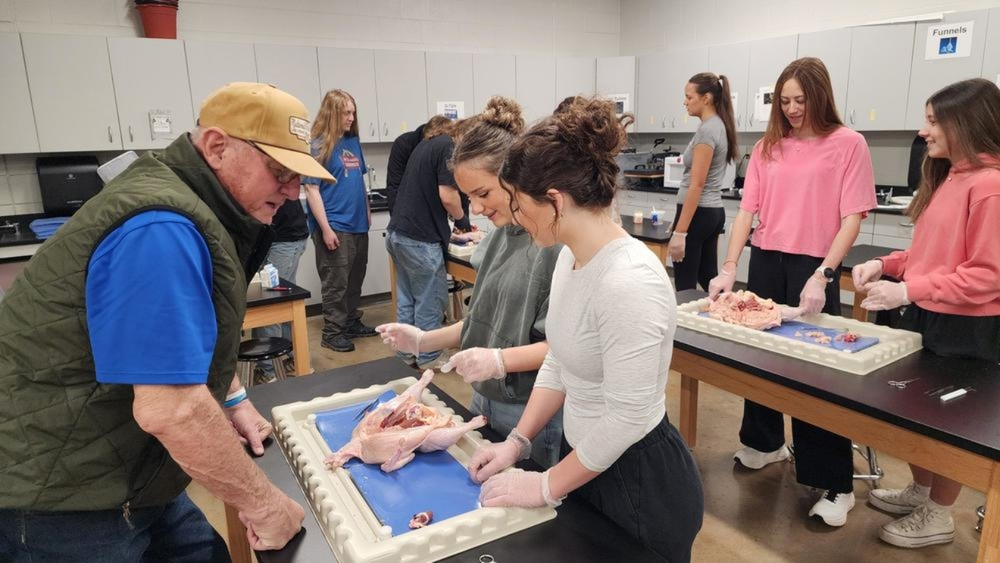 Mr. Emmett and students in lab