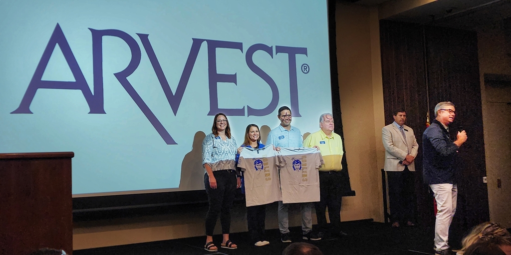 Arvest Banking Team presents shirts 