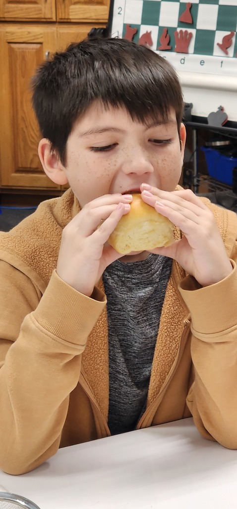 student sampling churned butter