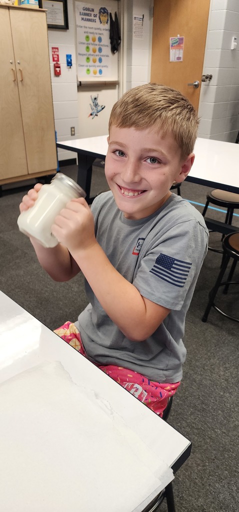 student churning butter