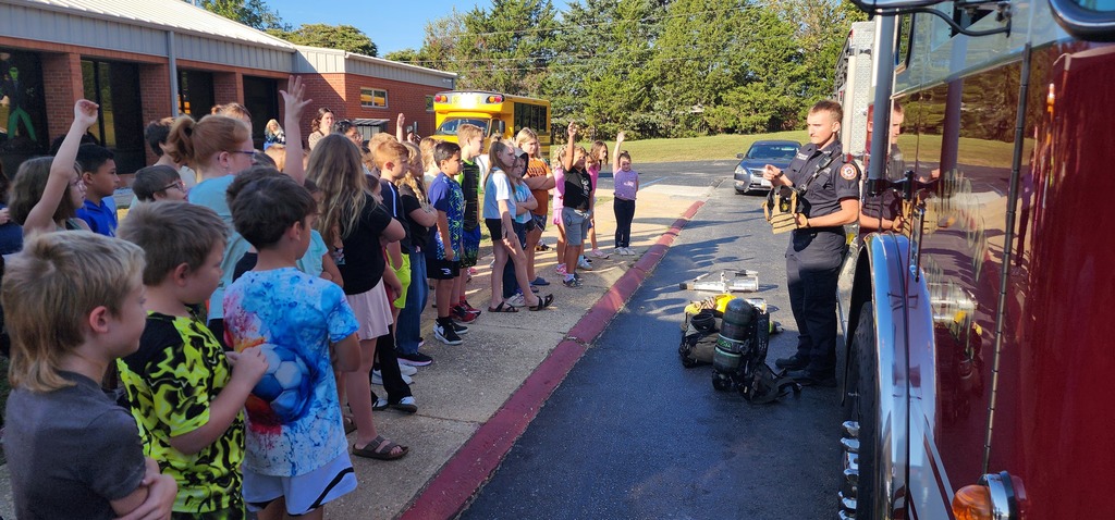 students listening to fireman