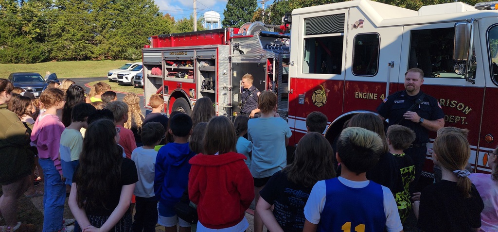 students listening to fireman