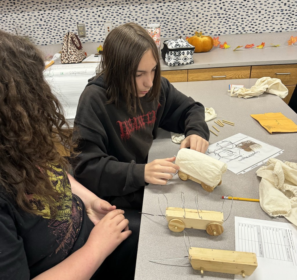 Students in Mrs. O’Dell’s Career Development classes took part in the Wagon Masters event, practicing bartering skills by building wagons! 🛠️ Each team had to trade and negotiate for the best wagon parts — a fun and creative way to learn real-world decision-making skills!  A big thank you to Boone County Extension Agents Denyse Hensley and Ashley Edson for bringing this wonderful activity to HMS! 💙💛  #HarrisonMiddleSchool #GreatGoblins #CareerDevelopment #WagonMasters #HandsOnLearning #RealWorldSkills #CommunityPartners