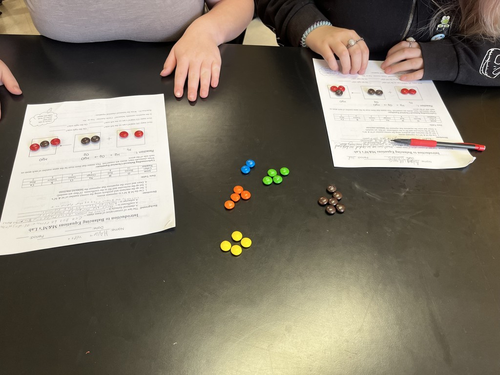 🍬 Science in Action! In Mrs. Bryant’s Science classes, students used M&M’s to represent atoms of different elements! By arranging and rearranging their candy “atoms” to balance chemical equations, they modeled how matter is neither created nor destroyed during a chemical reaction. ⚗️✨  This fun, hands-on activity was a sweet way to explore the Law of Conservation of Mass! 💙💛 #HarrisonMiddleSchool #GreatGoblins #HMSScience #HandsOnLearning #STEMFun #ScienceIsSweet