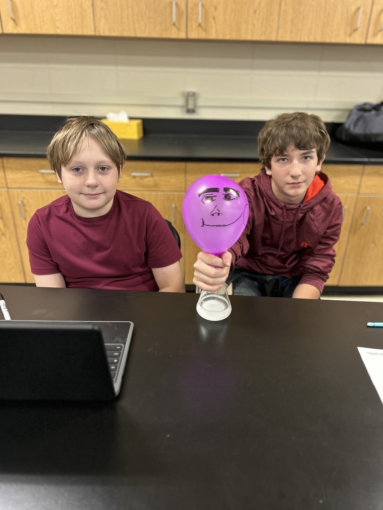 🎈 Science in Action! Mrs. Scoggins’ science students experimented with chemical reactions to review the Law of Conservation of Matter and balancing equations. ⚗️  By mixing acetic acid (vinegar) and sodium bicarbonate (baking soda), students produced carbon dioxide gas — enough to inflate their balloons! 🎈💙💛  #HarrisonMiddleSchool #GreatGoblins #HMSScience #HandsOnLearning #STEMFun #ChemicalReactions