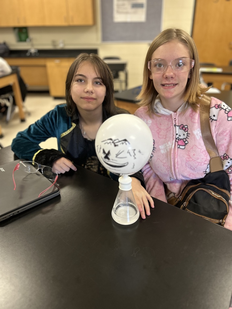 🎈 Science in Action! Mrs. Scoggins’ science students experimented with chemical reactions to review the Law of Conservation of Matter and balancing equations. ⚗️  By mixing acetic acid (vinegar) and sodium bicarbonate (baking soda), students produced carbon dioxide gas — enough to inflate their balloons! 🎈💙💛  #HarrisonMiddleSchool #GreatGoblins #HMSScience #HandsOnLearning #STEMFun #ChemicalReactions