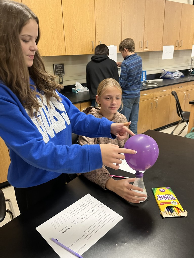 In Mrs. Bryant’s science class, students experimented with acetic acid and sodium carbonate. When these two reactants were combined inside a balloon, they produced water, carbon dioxide, and sodium acetate — causing the balloon to inflate!  Students observed that the mass of the reactants equaled the mass of the products, demonstrating the Law of Conservation of Matter. ⚗️💙💛  #HarrisonMiddleSchool #GreatGoblins #HMSScience #HandsOnLearning #STEMFun #ConservationOfMatter