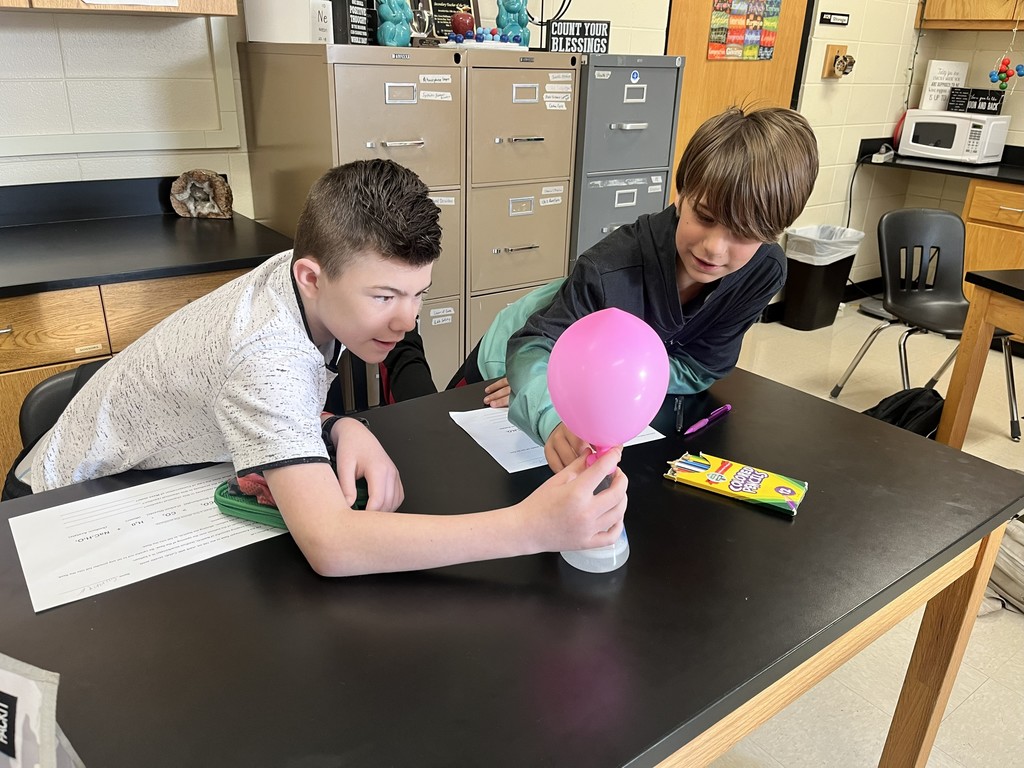 In Mrs. Bryant’s science class, students experimented with acetic acid and sodium carbonate. When these two reactants were combined inside a balloon, they produced water, carbon dioxide, and sodium acetate — causing the balloon to inflate!  Students observed that the mass of the reactants equaled the mass of the products, demonstrating the Law of Conservation of Matter. ⚗️💙💛  #HarrisonMiddleSchool #GreatGoblins #HMSScience #HandsOnLearning #STEMFun #ConservationOfMatter