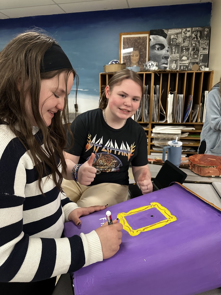 🎨🗑️ Turning Trash into Treasure! 🗑️🎨 Kayleigh Brandon and Emma Croft designed and painted this fun, creative trashcan for Mrs. Thurman’s classroom! The girls wanted to make our environment more colorful and inviting — and they definitely delivered! 💜✨ They chose a classic Friends theme, featuring the iconic purple door highlighted with the gold frame around the peephole. Such a fun and recognizable design! 🚪⭐ We love seeing our students use their creativity to brighten our school and make learning spaces even more enjoyable. Great job, girls! 💙 #HarrisonMiddleSchool #GoblinPride #StudentCreativity #HMSTalent