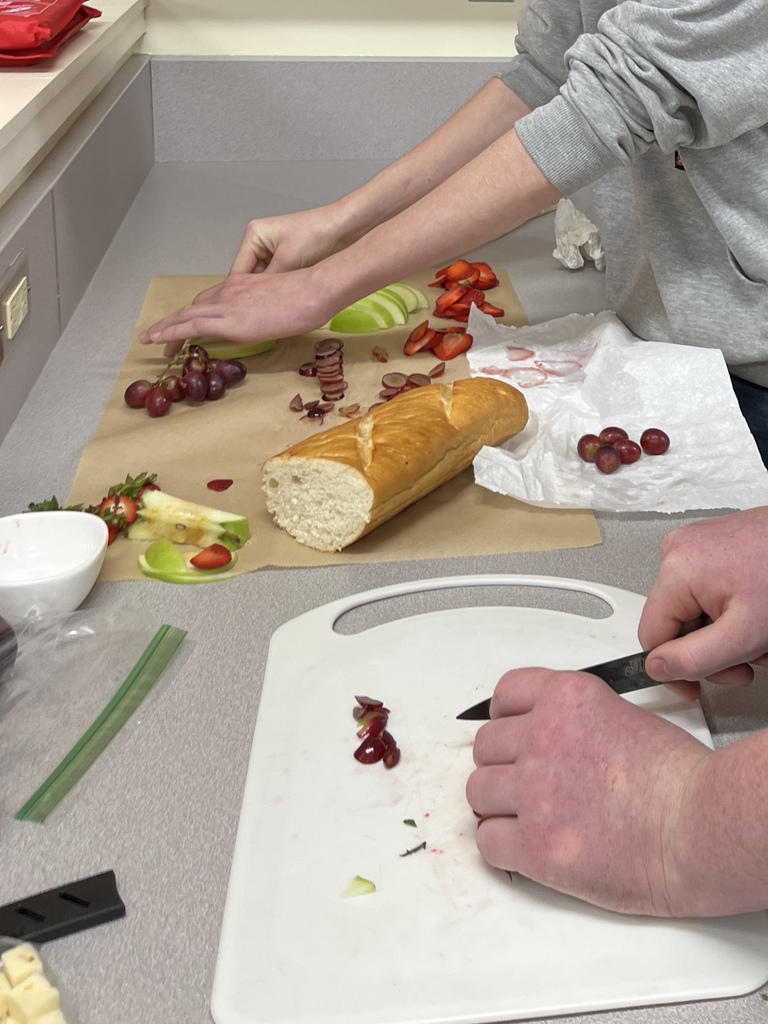 From playdough to professional platters! 🔪🧀  Our 8th-grade Menu Adventure students just wrapped up a two-week knife skills unit that was a total cut above the rest!  After perfecting their technical knife skills using student-made playdough, these young chefs stepped into the kitchen lab to master the real deal. The grand finale? A high-stakes Charcuterie Challenge where students created stunning displays of meats, cheeses, and fruits.  The best part — our school staff served as official judges, casting votes for their favorite boards based on presentation and technique. It was easily one of the most popular (and delicious!) assignments of the year!  We are so proud of the focus, creativity, and teamwork these students brought to the kitchen! 👏✨  #MenuAdventure #CTE #FutureChefs #KnifeSkills #CharcuterieChallenge #HandsOnLearning #MiddleSchoolMagic #StudentSuccess