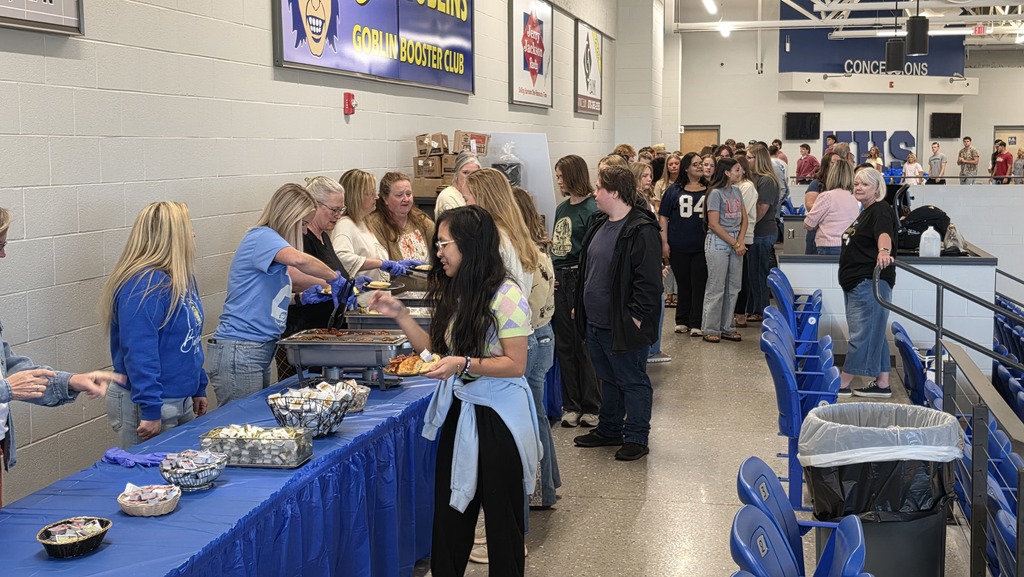 students being served breakfast