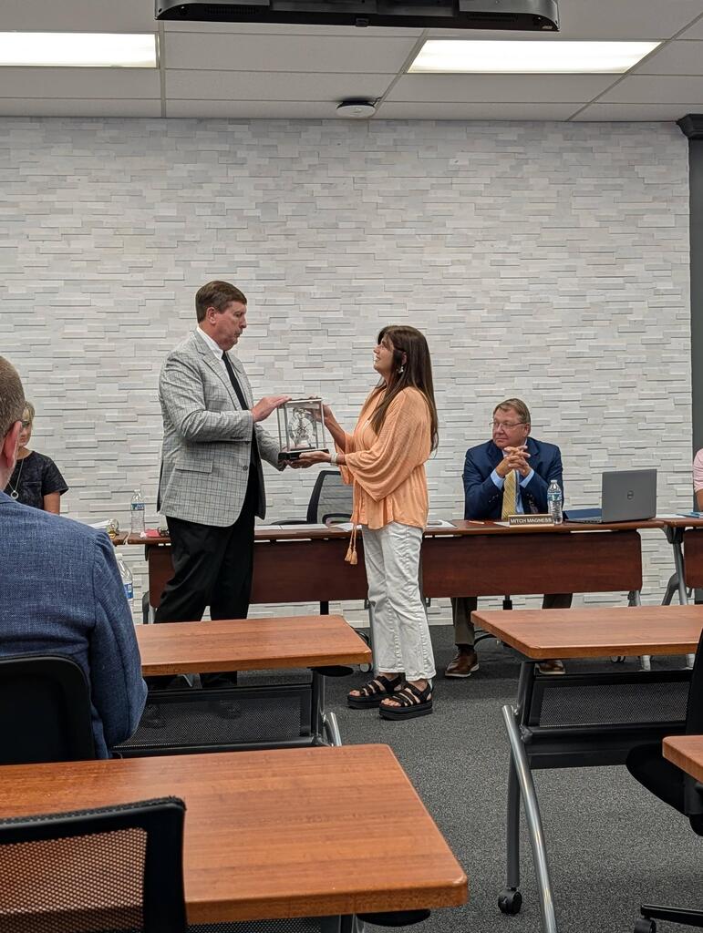 Marisa Keylon receiving her board recognition for service award.