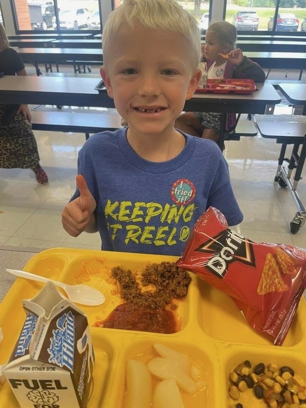 child giving thumbs up