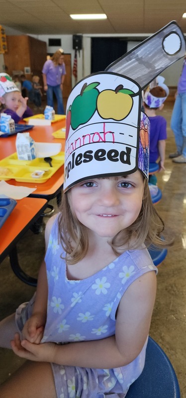 student wearing "johnny appleseed" hat