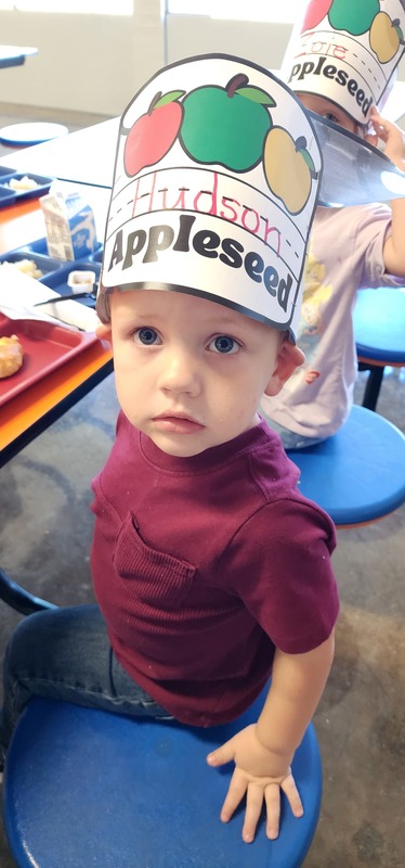 student wearing "johnny appleseed" hat