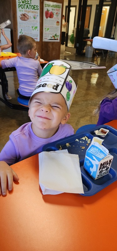 student wearing "johnny appleseed" hat
