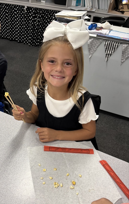 student with chopsticks