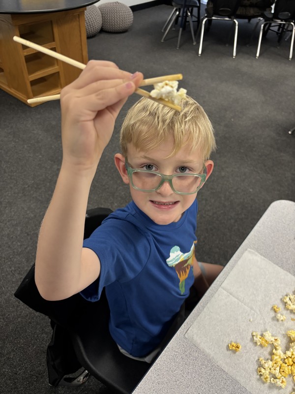 student with chopsticks