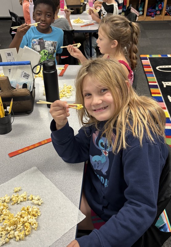 student with chopsticks