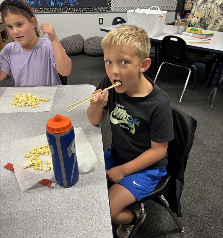 student with chopsticks