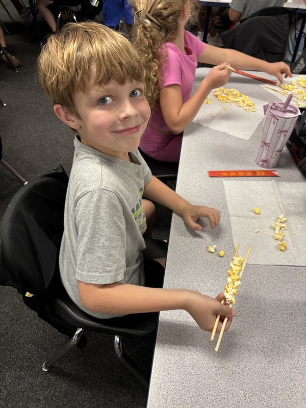 student with chopsticks