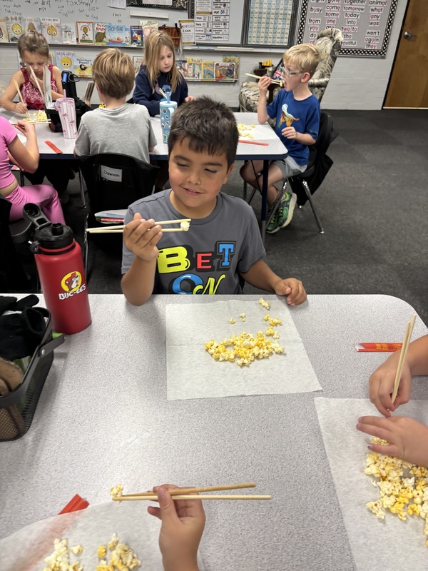 student with chopsticks