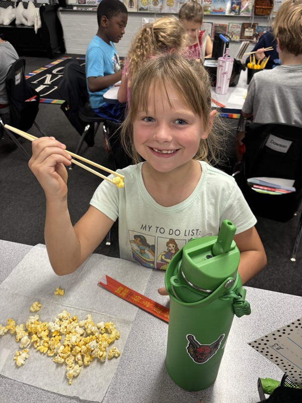 student with chopsticks