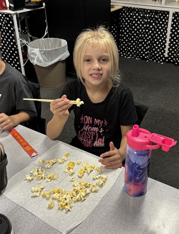 student with chopsticks