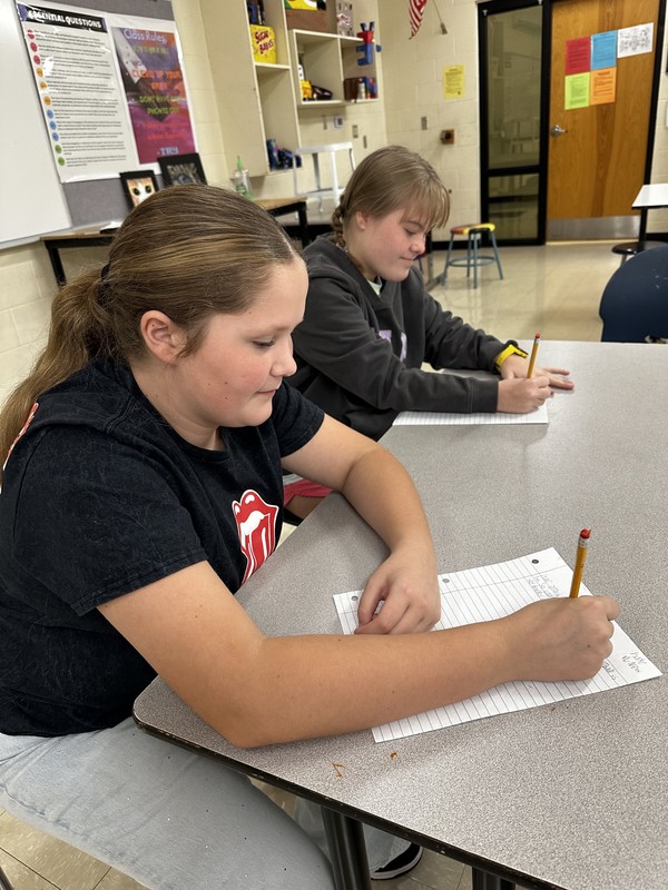 students writing letters