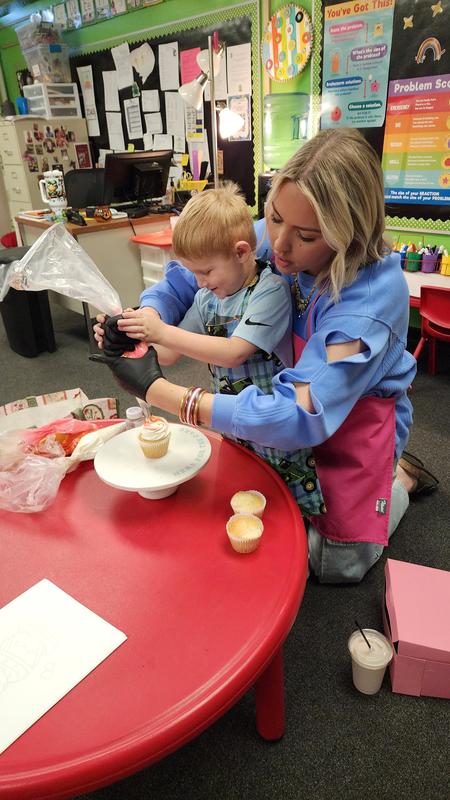 Students watching cupcake demonstration