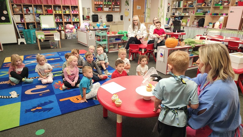 Students watching cupcake demonstration