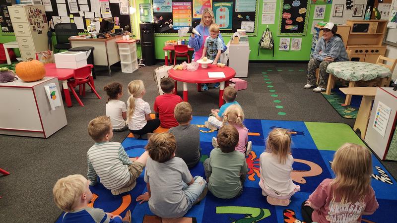 Students watching cupcake demonstration