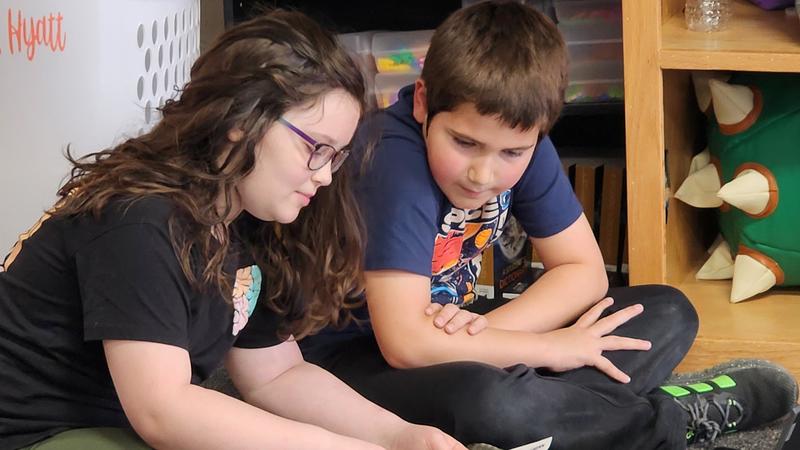 students at work on podcasts