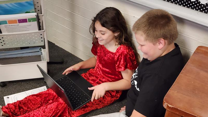 students at work on podcasts