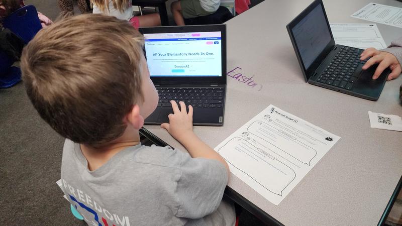 students at work on podcasts